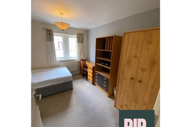 A Cozy Double Bedroom Featuring A Comfortable Bed ...