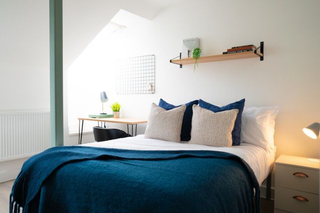 A Bright And Inviting Double Bedroom With Stylish ...