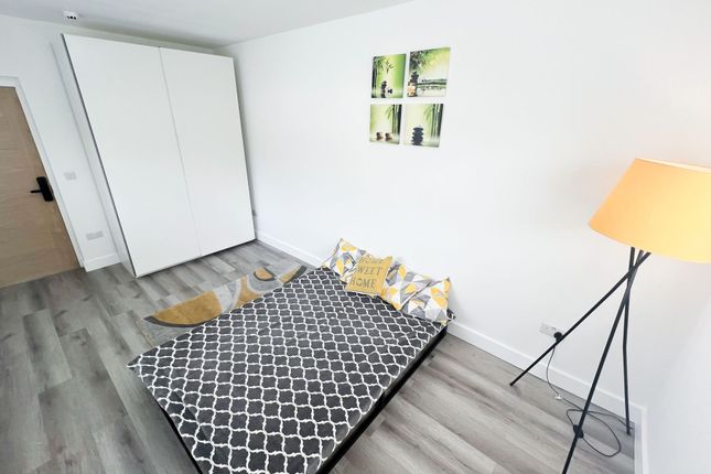 A Bright And Modern Double Bedroom Featuring A Coz...