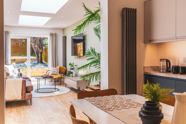 A Spacious And Bright Modern Living Room With A St...