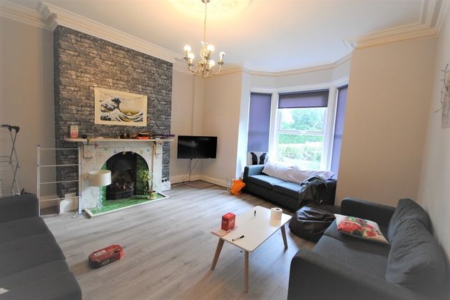 Bright And Inviting Living Room With A Large Windo...