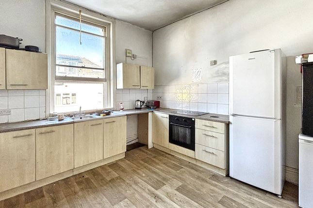 A Bright And Clean Kitchen With Ample Natural Ligh...