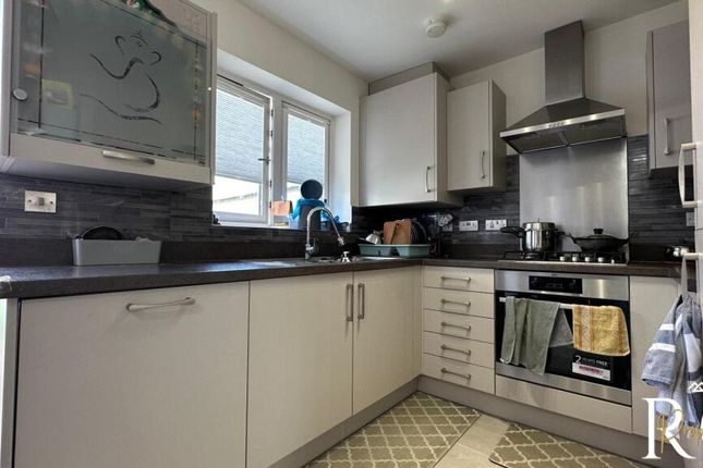 A Bright And Tidy Kitchen With Modern Cabinetry, A...