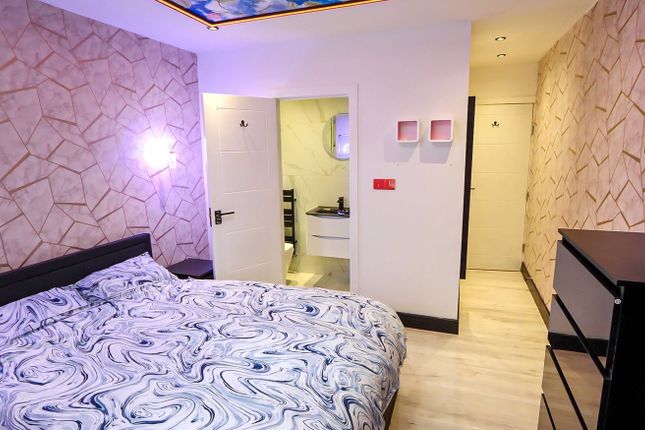 A Stylish And Inviting Double Bedroom Featuring Mo...