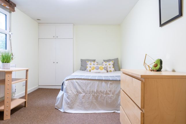 A Cozy Double Bedroom Featuring A Comfortable Bed ...