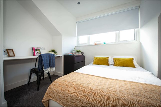 Bright And Inviting Master Bedroom Featuring A Com...