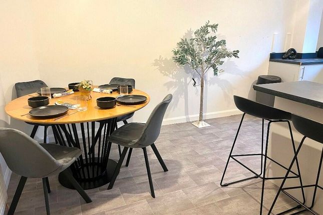 A Modern Living Room Area Featuring A Stylish Roun...
