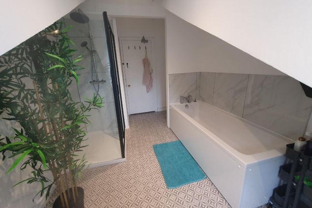 A Modern And Spacious Bathroom Suite Featuring A l...