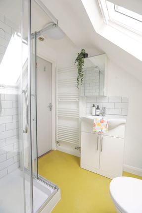 A Bright And Modern Bathroom Featuring A Spacious ...