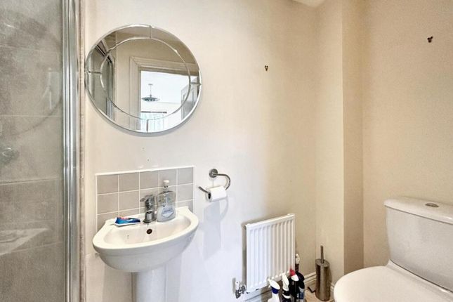 A Modern Bathroom Featuring A Sleek Shower, Contem...