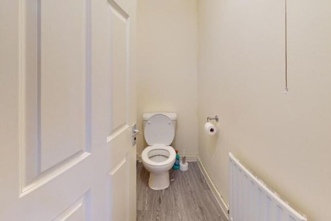 A Clean And Simple Single Toilet Room With Light-c...