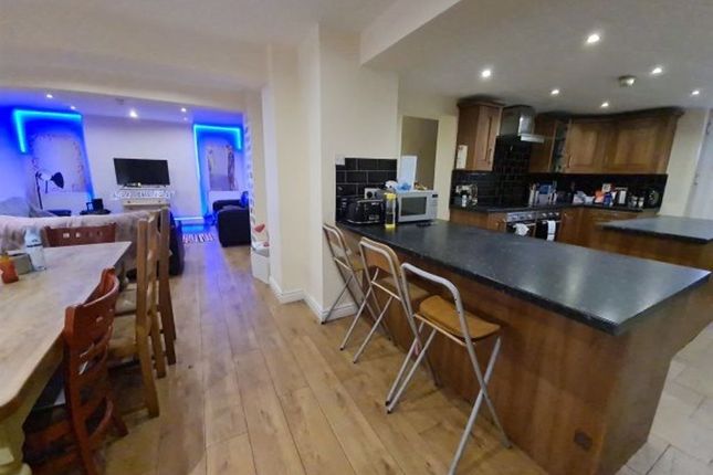 A Spacious, Modern Kitchen Featuring A Large Islan...