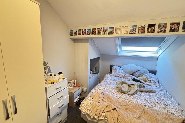 A Spacious And Well-Lit Bedroom Featuring A Large ...