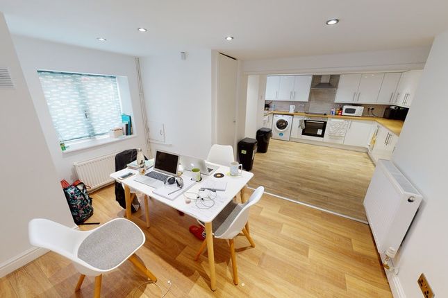 A Bright And Welcoming Living Room Featuring Moder...