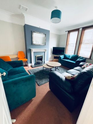 Bright, Cosy Living Room With Teal Sofas And Match...