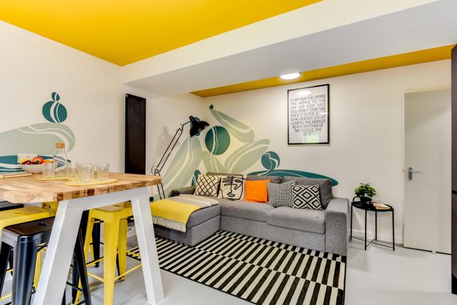 Bright, Modern Living Area With A Comfortable Grey...