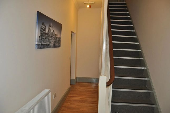 A Clean And Well-Maintained Hallway Featuring Wood...