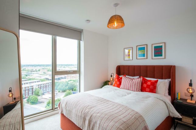 Bright And Stylish Master Bedroom Featuring A Larg...