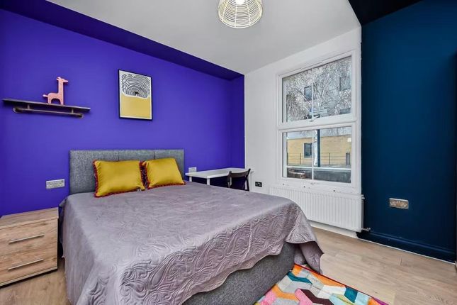 A Bright And Modern Bedroom Featuring A Large Bed ...