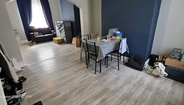 A Spacious Living Room With Light Wooden Flooring ...