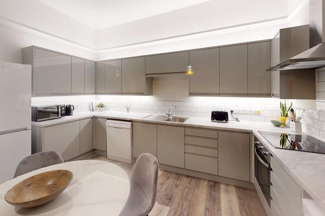A Modern And Spacious Kitchen With Ample Natural l...