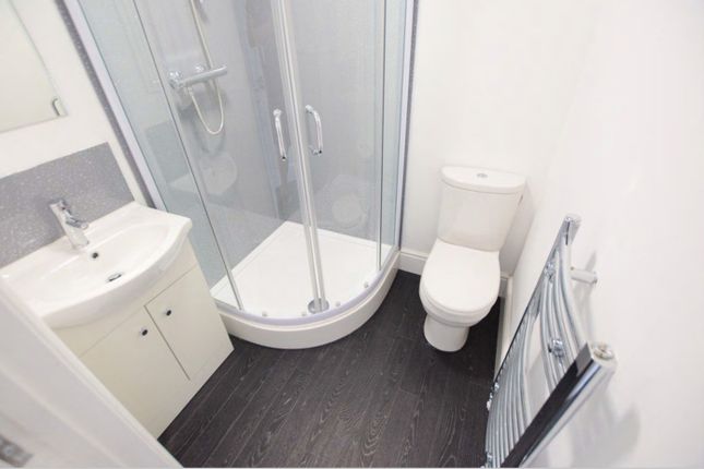 A Modern And Clean Bathroom Featuring A Stylish Sh...