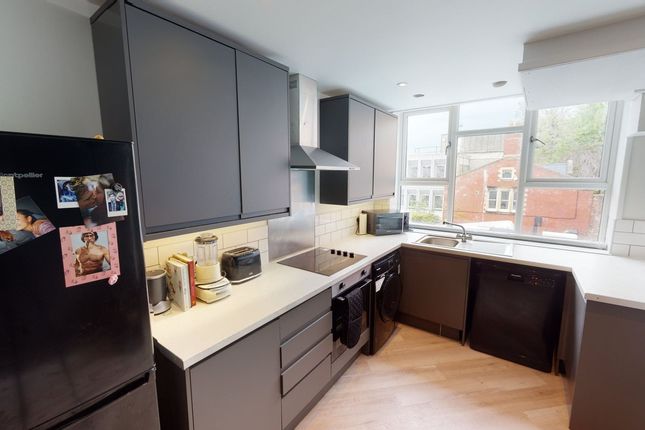 A Modern And Well-Equipped Kitchenette With Ample ...