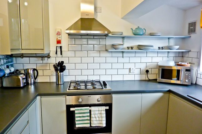 This Modern Kitchen Features Sleek Cabinetry, A Co...