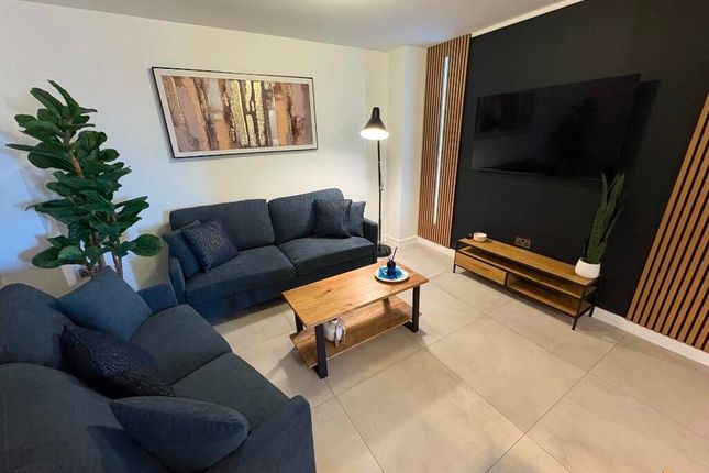 A Contemporary Living Room Featuring Comfortable N...