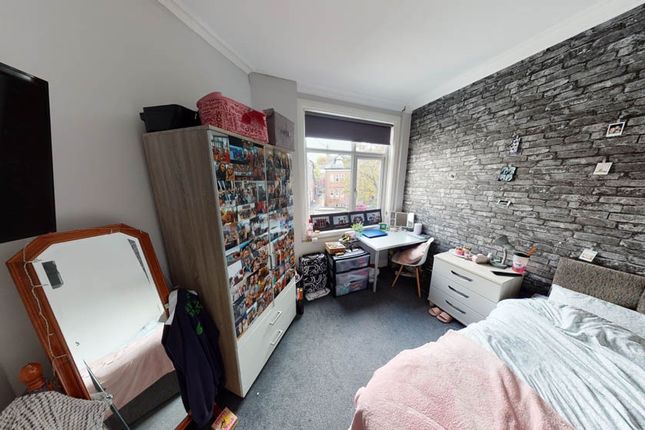 A Cozy Bedroom With A Single Bed, A Fitted Wardrob...