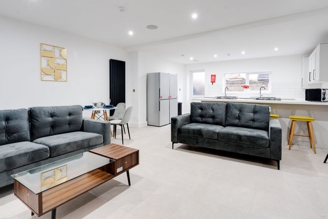 A Modern And Spacious Living Area Featuring Two St...