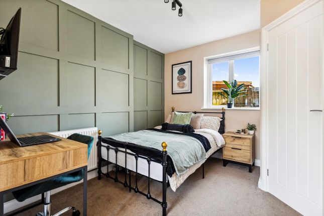 This Charming Double Bedroom Features A Stylish De...
