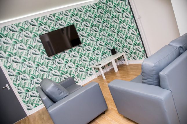 A Stylish Living Room Featuring Modern Furnishings...