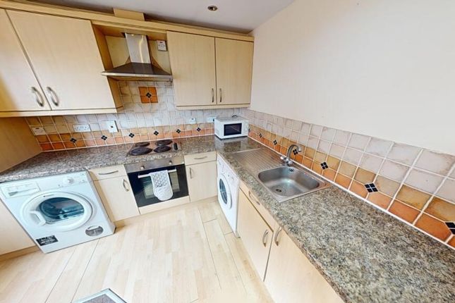 Bright And Tidy Kitchen Featuring Modern Appliance...