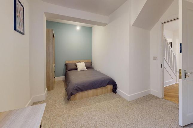 A Bright And Tidy Double Bedroom With A Modern Aes...