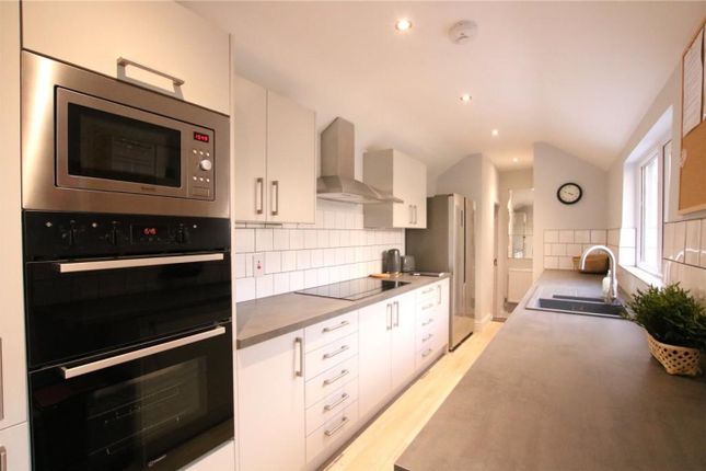 A Modern And Clean Kitchen Featuring Sleek Applian...