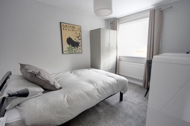 A Bright And Tidy Double Bedroom Featuring Modern ...
