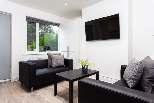 A Stylish And Contemporary Living Room Featuring T...