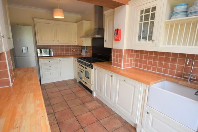 A Charming Kitchen Featuring Ample Counter Space, ...