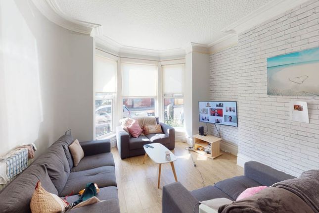 Bright And Welcoming Living Room Featuring A Spaci...