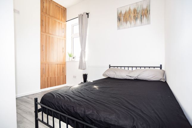 A Bright And Airy Double Bedroom Featuring A Comfo...