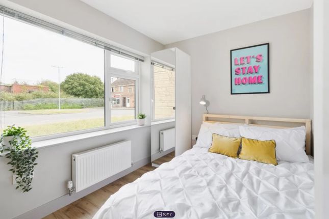 A Bright And Cozy Double Bedroom Featuring Large W...