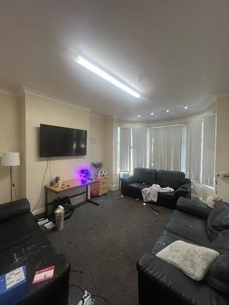 A Spacious And Comfortable Living Room Featuring m...