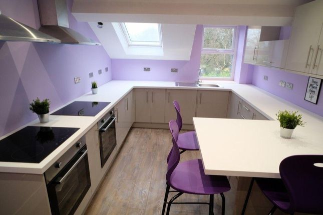 Bright And Modern Kitchen Featuring Stylish Purple...