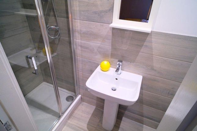 A Modern Bathroom Featuring A Walk-In Shower With ...