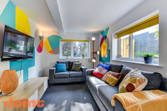 Bright And Contemporary Living Room Featuring Styl...