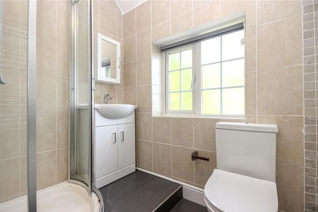 A Modern And Clean Bathroom Featuring Ample Natura...
