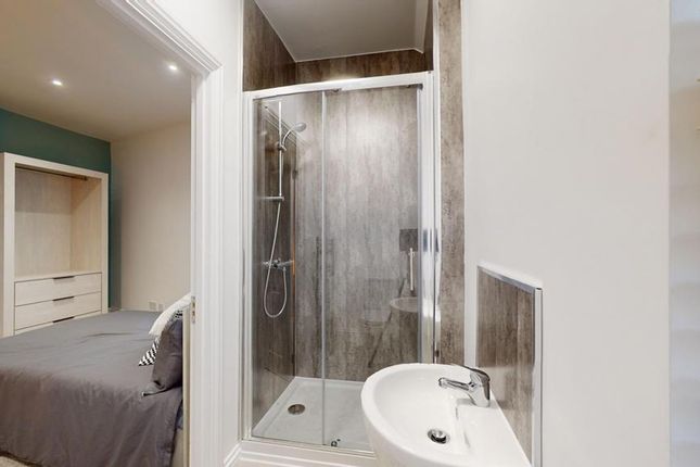 A Stylish And Modern Double Bedroom Featuring An E...