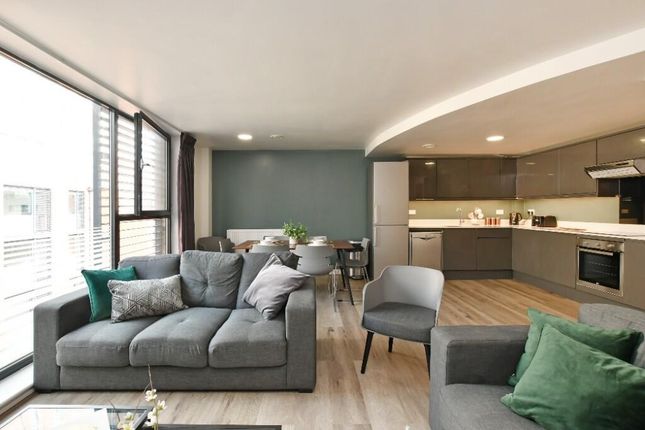 Bright And Modern Living Room Featuring A Comforta...