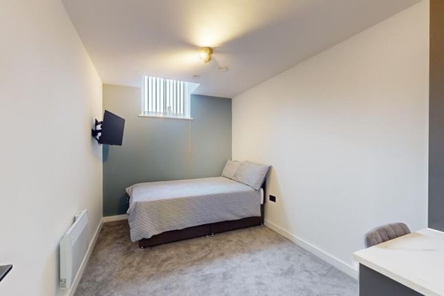 A Spacious And Tidy Double Bedroom Featuring A Com...
